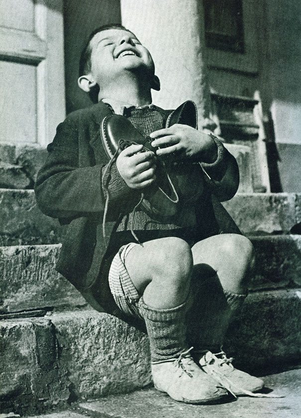 Austrian boy receives new shoes during WWII 