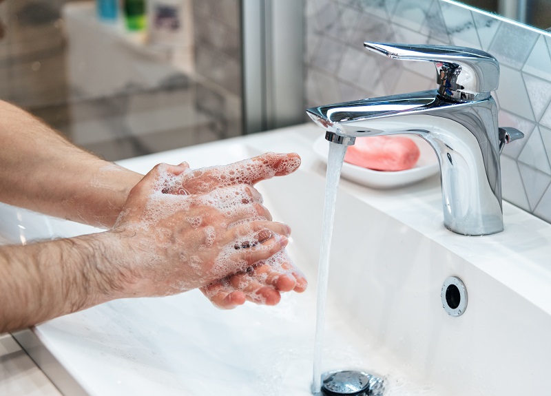 man washing hands