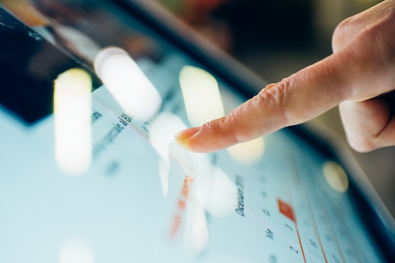 finger touching a screen